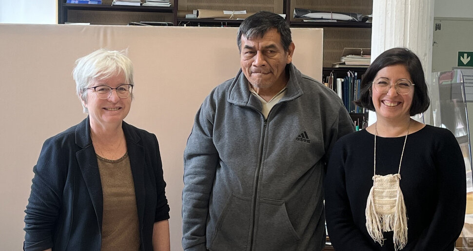 Three people look into the camera